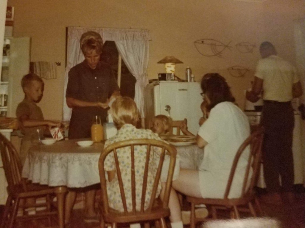 My family eating a  pancake breakfast at the cottage.